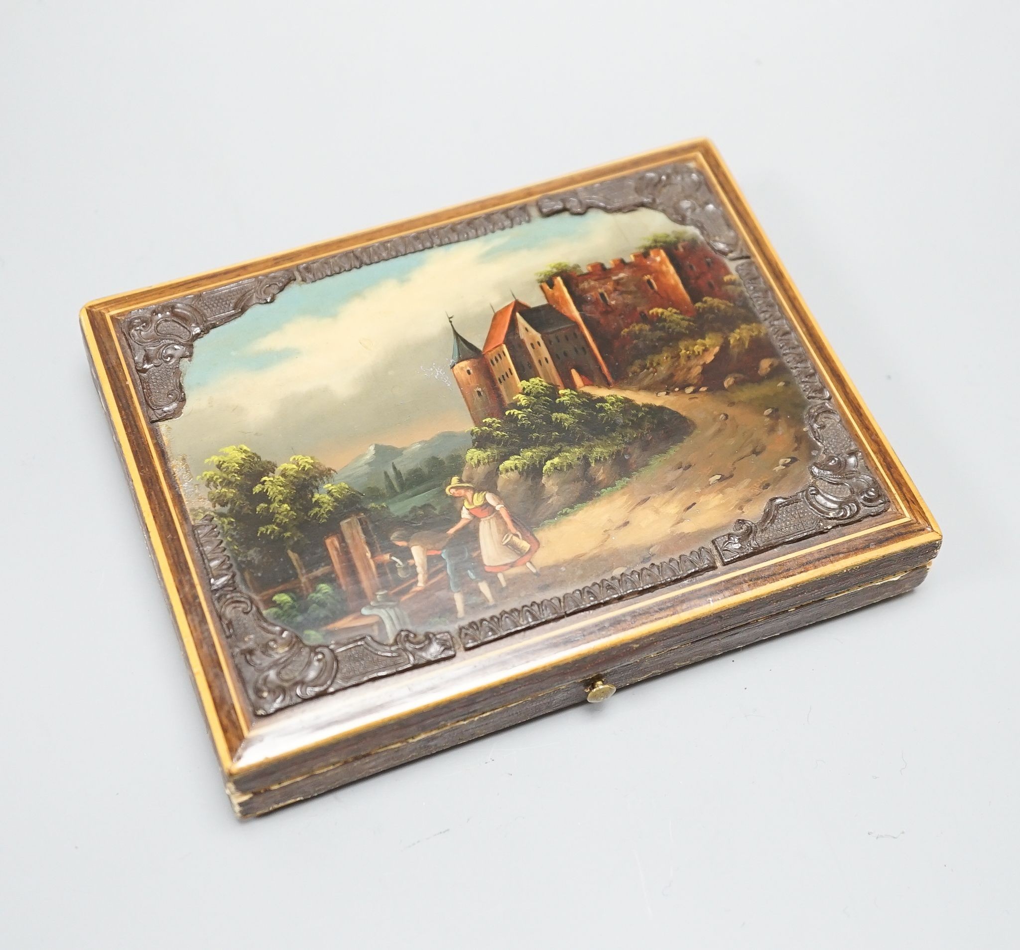 A 19th century European necessaire, with a painted figurative landscape scene on the cover, 15 cms wide x11 deep.